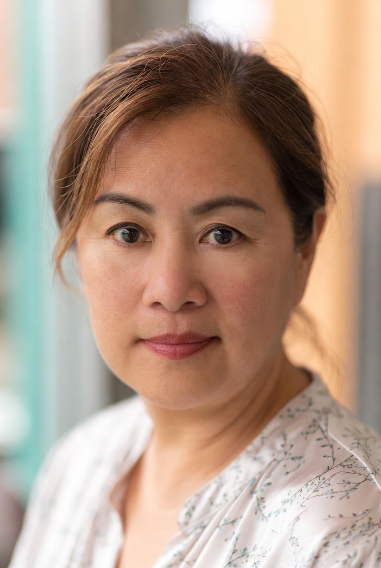 Portrait of Dr. Nadia Hale, lead aesthetic physician, in soft natural light